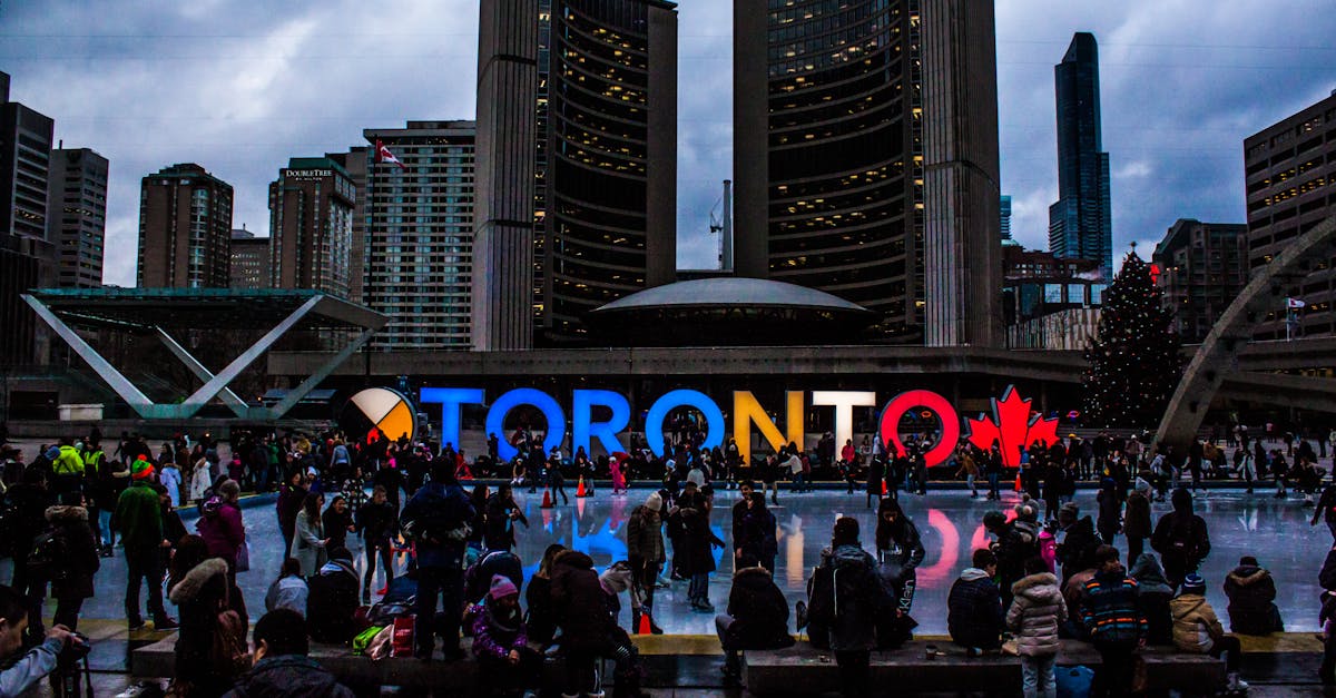 People Gathered in Front of Toronto Freestanding Signage